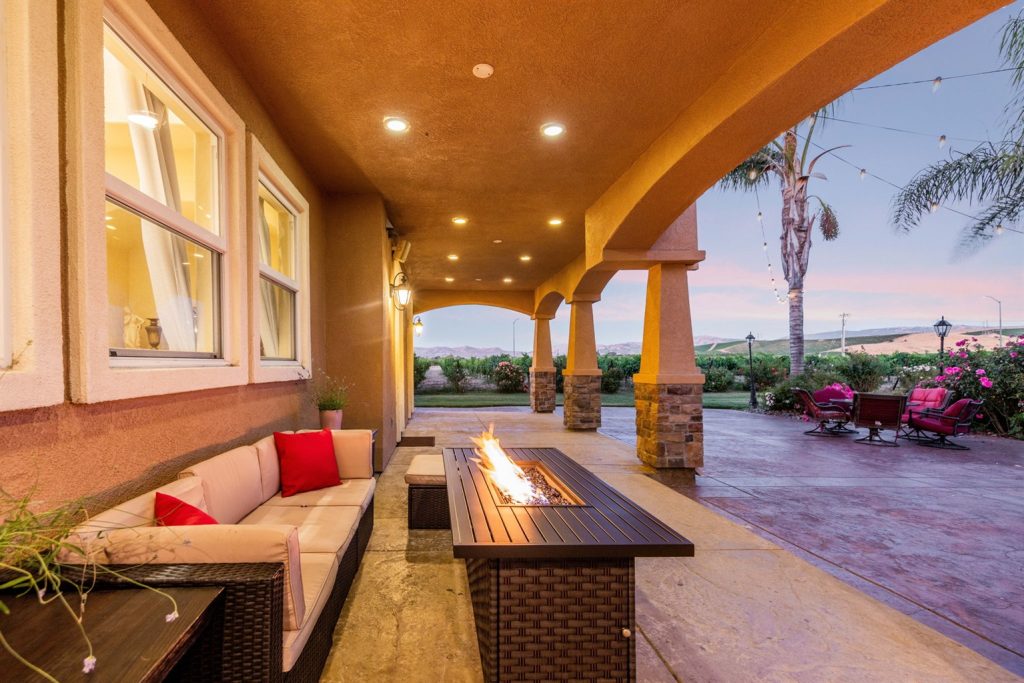 Estate terrace at sunset over the vineyard